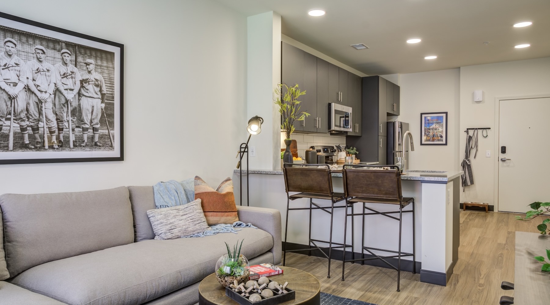 living room with couch and view of a kitchen